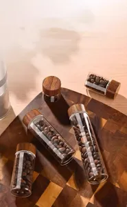 Multiple sizes of mini glass storage vials with wood-grain lids for coffee beans