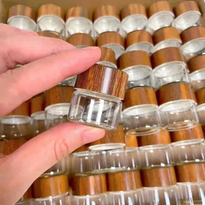 Close-up of a mini glass jar with a realistic wood-grain textured lid for storage.