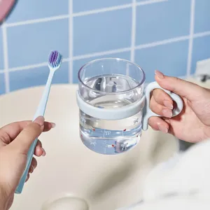 Cute heart and bow patterned mouthwash cup with matching blue soft toothbrush set