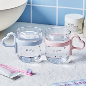 Cute heart-shaped handle gargle cups for couples featuring ribbon and heart prints