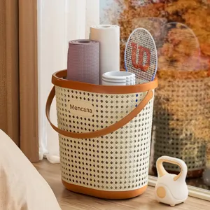 Large capacity beige rattan style laundry basket with handle for home gym storage.