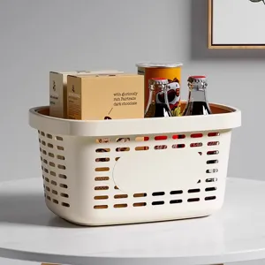 Minimalist cream plastic storage basket with a hollow grid design for bathroom organization