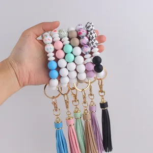 Silicone beaded keychain bracelet with leather tassel, colorful stylish wristlet keyring for women.