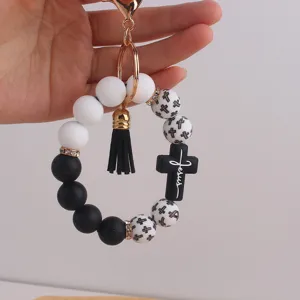 Silicone bead wristlet keychain with black cross charm and PU tassel for women keys stylish.