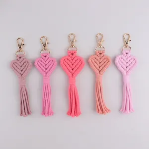 Handmade woven macrame heart tassel keychain detail view, stylish bag charm accessory for daily use.