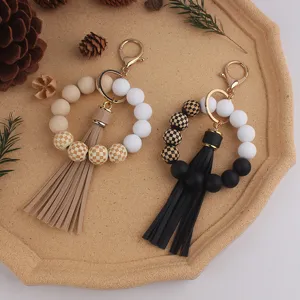 Checkered wood bead silicone keychain bracelet with leather tassel for women stylish accessories.
