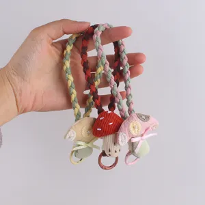 Cute cottagecore mushroom phone strap and keychain, aesthetic braided wrist lanyard pendant.
