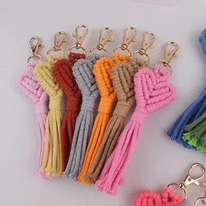 Bohemian handmade woven heart tassel keychain charm, stylish cotton rope bag accessory.