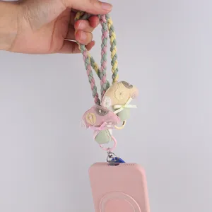 Close-up detail of cute mushroom braided phone wrist strap, sweet style candy colors.