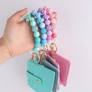 Set de tarjetero con pulsera de silicona y lazo, elegante cartera de mujer y llavero.