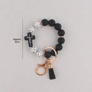 Silikon Perlen Schlüsselanhänger Armband mit schwarzem Kreuz Anhänger, modisches Accessoire.