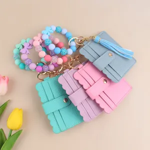 Elegante cartera tarjetero con pulsera de cuentas de silicona y borla para mujeres.