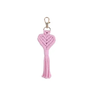 Handmade bohemian pink heart macrame keychain with gold clasp for stylish bag charm accessory.