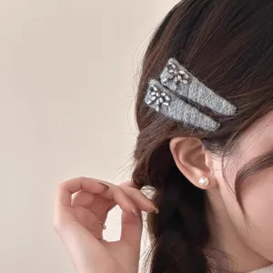 Detail view of Korean style grey rhinestone hair clip worn on side bangs, elegant daily hair accessory