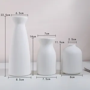Dimensions détaillées de trois vases en céramique blanche minimalistes de tailles variées