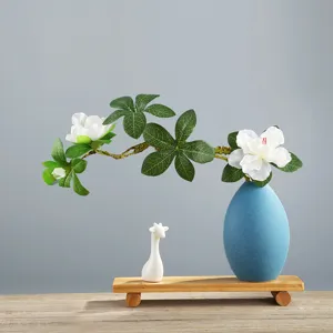 Modern minimalist blue ceramic vase set with artificial white flowers and wooden stand