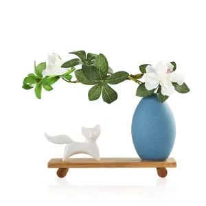 European style ceramic vase set with white fox figurine and wooden display stand