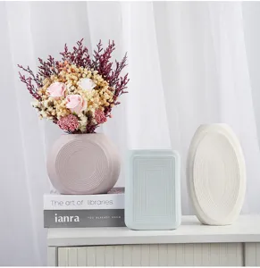 Minimalist matte ceramic vase set in pink, blue and white for elegant home decor