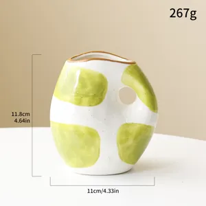 Wabi-sabi ceramic vase with hand-painted green dots and dimensions shown