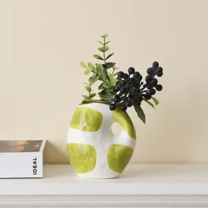 Hand-painted green dot ceramic vase with handle detail for modern artistic home decor