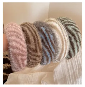 Plush wide headband for women, winter fuzzy hair hoop, comfortable daily makeup hair accessory.