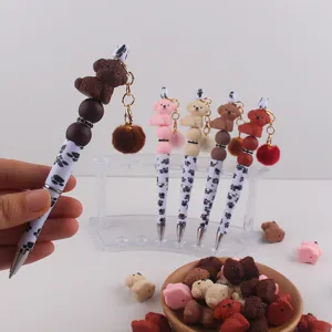 Niedlicher Welpe Perlen Gelstift mit flauschigem Pompon Anhänger, Silikon Cartoon Hund Stift.