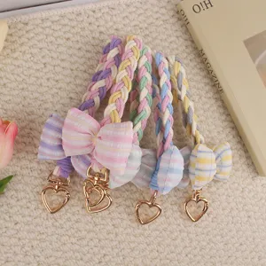 Macaron braided bow keychain and bag charm with cute heart clasp, detailed view of cute strap.