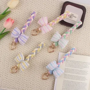 Macaron color braided bow keychain with heart clasp, cute bag pendant and charm accessory.