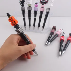 Halloween Perlen Gelstift mit süssen Silikon Kürbis Geist Anhängern, schwarzer Kugelschreiber.