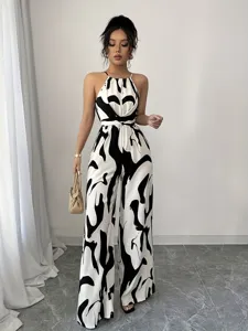 High-quality detailed shot of the black and white milk pattern print on this halter jumpsuit