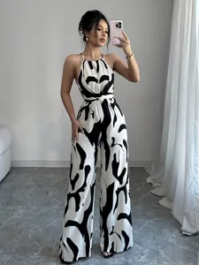 Elegant black and white milk pattern halter neck jumpsuit with wide-leg trousers