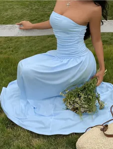 Detail view of a light blue strapless ruched maxi dress for elegant summer vacations.