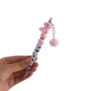 Süßer Pompon Perlen Gelstift mit rosa Silikon Hund Anhänger, kreativer Kugelschreiber für Schüler.
