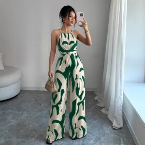 Stylish halter neck wide-leg jumpsuit featuring green abstract marble print and cinched waist