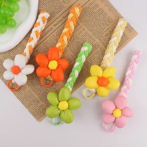 Süße geflochtene Blumen Handy-Umhängeband und Schlüsselanhänger Set stilvolles Design.
