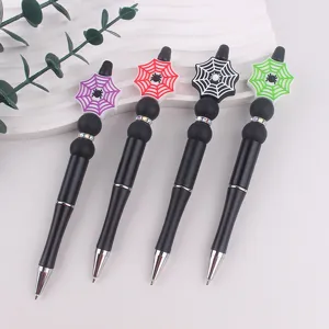 Penne con perline in silicone con ragnatela creativa, corpo nero e strass luminosi.