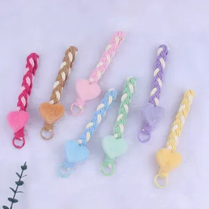 Cute plush heart braided phone charm and bag pendant keychain for women, colorful design.