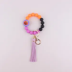 Halloween silicone beaded wristlet keychain with cute pumpkin charm and stylish tassel.