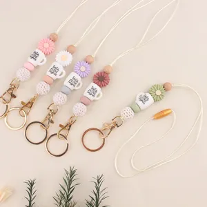 Gedetailleerd overzicht van kleurrijke siliconen kralen lanyards met houten details en sluitingen.