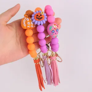 Halloween silicone beaded wristlet keychain with pumpkin tassel charm for women girls keys.