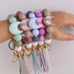 Pulsera llavero de cuentas de silicona con colgante de luna y borla para mujeres chic