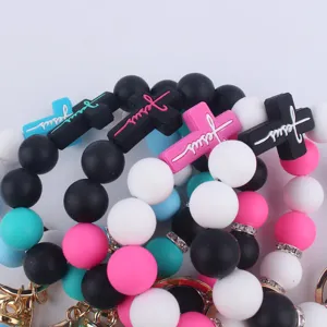 Silicone cross beaded bracelet keychain with colorful beads and metal keyring charm detail.