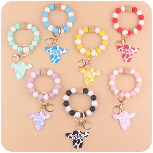 Colorful silicone bead wristlet keychain with cute cow head pendant for keys and bags.