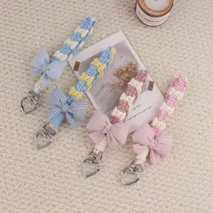 Handmade woven bow mobile phone lanyard and cute heart keychain charm pendant for daily use.