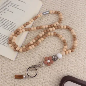 Cordino in perle di legno con ciondolo a fiore e nappa per badge, bello accessorio.
