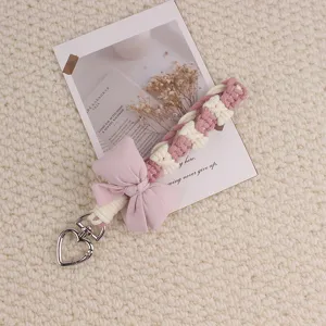 Handmade braided bow phone strap keychain, pink woven keychain accessory for cute style bags.