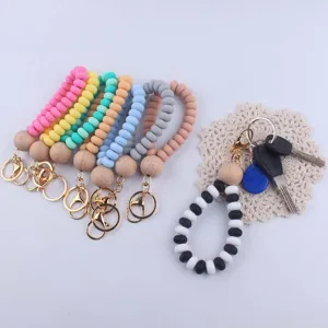 Colorful silicone beaded wristlet keychain with wooden beads and metal clasp for keys.