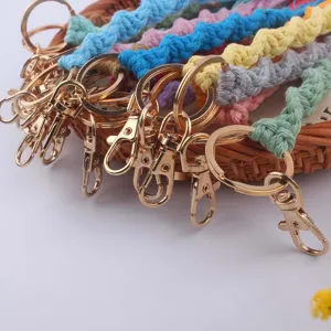 Handmade colorful macrame keychains detail shot, featuring durable gold metal lobster clasps.