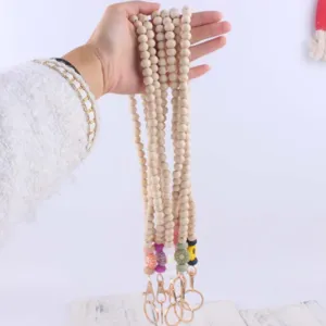 Holzperlen Lanyard Schlüsselanhänger mit bunten Silikon Gänseblümchen Anhängern und Metall.