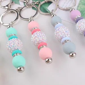 Colorful silicone rhinestone ball keychain detail, stylish bling bag charm and keyring accessory.